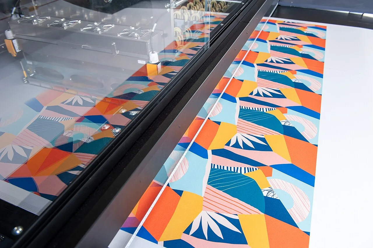 Textile flatbed printer printing colorful fabric